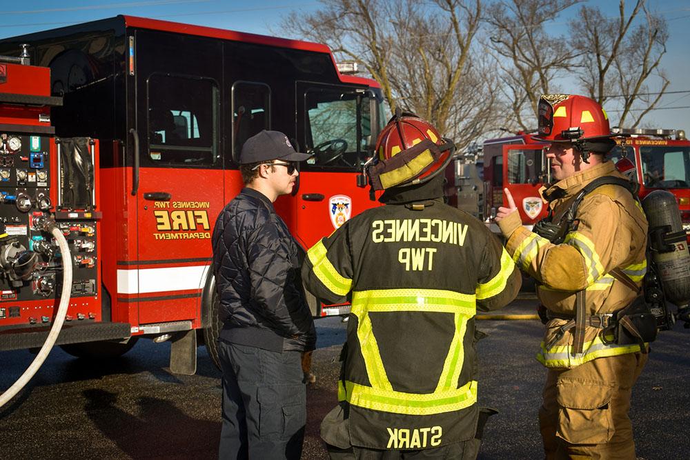 fire fighters in front of truck