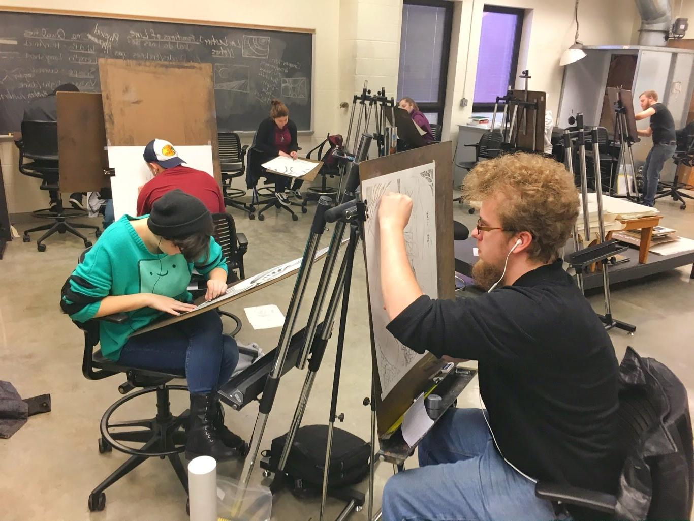 Students drawing in art studio